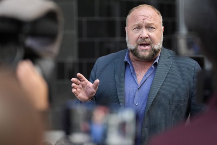 The satirical news site The Onion isn’t waiting to take possession of Infowars to launch a parody of Alex Jones ’ conspiracy platform.
More than a year after first trying to buy Infowars, The Onion on Thursday will debut a send-up under its own website with plans to give some of the revenue to families of the victims in the Sandy Hook Elementary School shooting.
The families have still received no money from Jones since courts ordered him to pay more than $1 billion for falsely calling the 2012 shooting a hoax.
The Onion will start by sending the families $100,000 from merchandise sales that combine the conspiracy empire’s brand with the The Onion’s logo in rainbow colors, according to CEO Ben Collins, whose company is still in court trying to take control of Infowars.
“Don’t give comedy writers a grudge for 18 months,” Collins said.
The parody will include a series of shows and other content under Infowars branding that spoof Jones’ aggressive mashup of conspiracies linking major news events, dubious scientific claims, attacks on people suffering in tragedies and sales of supplements and survival gear.
Alex Jones in Houston in 2024.David J. Phillip / AP file
Jones’ claims that the 2012 shooting that killed 20 first graders and six adults at Sandy Hook Elementary School in Connecticut is a hoax have no truth, but Jones continued to amplify them. His followers started to harass victims’ families, suggesting they were “crisis actors” and even making death threats.
Jones’ Infowars empire had 10 million visitors a month and generated more than $50 million in annual revenues at its peak, according to the company. But the $1.4 billion judgments in defamation cases in Connecticut and Texas, where Jones is based, forced him into bankruptcy and broke Infowars apart.
“All he’s been left with is an iPhone and a fancy microphone,” said Chris Mattei, an attorney for nine of the Sandy Hook families.
Jones has moved his show to a different website. An email sent to an address to request interviews went unanswered.
The families knew they could never stop Jones from getting his message out, and he has managed to avoid paying the judgment so far. But they could expose what he said and assure he can never profit again, Mattei said.
“Every dime Alex Jones makes from here until the end of eternity is going to be claimed by the families,” Mattei said.
The Onion stepped in when Collins saw Infowars’ assets were going to be sold at auction.
Collins spoke to Sandy Hook families, who said they were briefly skeptical, but then saw how The Onion’s staff could use the Infowars style and branding to take the moral high ground and make fun of the people who not only caused them so much pain but they felt also poisoned society.
Collins didn’t want to give away too much of the new stuff before it goes live Thursday.
But the new Infowars will maintain The Onion’s sharp satire sprinkled with shock value. Collins said there will be a section selling a penis flattening device, a fake “pro oxygen” supplement pill that the host claims can replace breathing, as well as an extended debate on how many Bozo the Clowns there are.
“It’s old-fashioned Infowars — using the tricks that they use to get people addicted to outrage and, I would say, addicted to anticipation, trying to find the thing that’s around the corner that’s going to save your life,” Collins said.
The Onion will keep chasing Jones’ property. Collins thinks they will soon get control of the Austin, Texas, studio Infowars once used.
Some families can’t wait for that day. Collins said that Robbie Parker, whose daughter died at Sandy Hook, plans to read his book about fighting Jones while dealing with so much grief in the place Jones once sat.
The families at first wanted Infowars shut down forever and Jones never heard from again. But they are now looking forward to seeing what The Onion has planned, attorney Mattei said.
“The idea that it could be turned to some social good. I think it’s even better,” Mattei said. “So, yeah, I think the families are both pleased and amused with what they’ve been able to achieve here.”