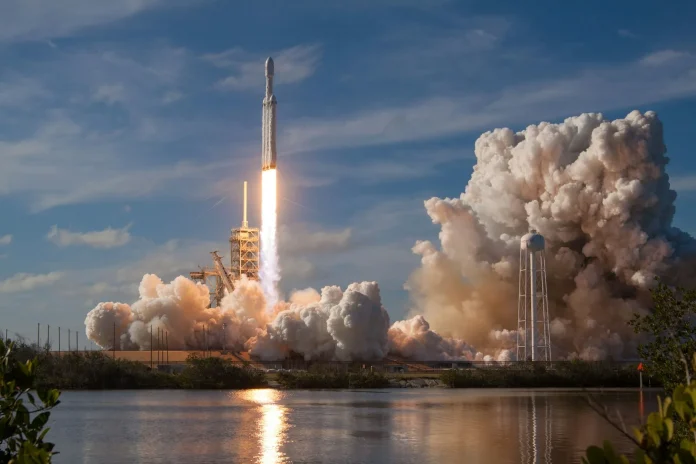 The comforting story about SpaceX stock is that Thursday's aborted Starship launch was just an engineering hiccup and the dip is a buying opportunity. Both halves might be true, but the framing misses what actually changed: for the first time in SpaceX's history, a routine test-flight abort — the kind that happened repeatedly before the IPO with zero financial consequence — is now a market event that erased billions in public-market value. SPCX trades near $125.40 as of July 17, 2026 (<a href="https://www.marketbeat.com/stocks/NASDAQ/SPCX/forecast/">MarketBeat</a>), below its $135 IPO price and down 18.5% since the June debut, after the company scrubbed its 13th Starship flight when four Super Heavy engines failed to ignite. The analyst spread on the same stock runs from CFRA's $115 bear case to Raymond James' $800 bull case — a seven-fold range that is the widest we have tracked across this entire bull-versus-bear series.
That $115-to-$800 spread is the story, because it is not a disagreement about a quarter — it is a disagreement about what SpaceX <em>is</em>. Having mapped this series across HIMS, Ethereum and the AI-infrastructure names, SPCX is the cleanest case yet of a private-market valuation dream colliding with public-market price discovery in real time. In the private secondaries, SpaceX was marked toward a $3 trillion-plus valuation on the promise of Starlink and Starship; in the public tape, retail that bought the hype above $200 is capitulating, and a crypto prediction market's odds of SPCX closing July higher collapsed from 61% to 32% in days, per <a href="https://www.benzinga.com/markets/prediction-markets/26/07/60516091/spacex-stock-july-prediction-market-odds-fall">Benzinga</a>. The abort did not change the engineering. It changed who sets the price — and that transfer, from patient private capital to daily public sentiment, is the real event.
<strong>Key Facts:</strong>
• SPCX trades near $125.40 (July 17, 2026), below its $135 IPO price and down 18.5% since the June 12 debut — <a href="https://www.marketbeat.com/stocks/NASDAQ/SPCX/forecast/">MarketBeat</a>, <a href="https://www.cnbc.com/2026/07/17/spacex-stock-starship-test-flight-aborted.html">CNBC</a>
• Bull case: $800 — Raymond James, implying roughly +398% upside — MarketBeat
• Bear case: $115 — CFRA, implying roughly −31% downside; Moffett Nathanson sits at $131 — MarketBeat
• Average 12-month target: ~$234–$244 across 32–37 analysts, a Moderate-to-Strong Buy consensus (24 Buys) — MarketBeat, <a href="https://www.tipranks.com/stocks/spcx/forecast">TipRanks</a>
• Starship Flight 13 aborted July 16 when four Super Heavy engines failed to ignite; two Raptors will be replaced — <a href="https://www.euronews.com/next/2026/07/17/four-engine-failures-abort-starships-13th-launch-bid-at-the-last-second">Euronews</a>
• Crypto prediction-market odds of SPCX closing July higher fell from 61% to 32% — <a href="https://www.benzinga.com/markets/prediction-markets/26/07/60516091/spacex-stock-july-prediction-market-odds-fall">Benzinga</a>
• SPCX was added to the Nasdaq-100 in early July, then fell below its debut price in a multi-day slide — <a href="https://www.cnbc.com/2026/07/08/spacex-stock-nasdaq-100-ipo.html">CNBC</a>
What's actually happening: the first launch as a listed company
Flight 13 was the first Starship test since SpaceX became a public company, and that context turned a familiar engineering ritual into a governance-grade event. The launch window opened at 5:45 p.m. Texas time on July 16; the automatic abort fired before liftoff when the Super Heavy booster's startup sequence left at least four engines unlit. The safety system did exactly what it is built to do — too few engines is a scrubbed launch, not a failed one — and pre-IPO, that distinction was academic to anyone but engineers. Post-IPO, it printed red on a Nasdaq-100 component.
Elon Musk narrated the abort in real time. "Some of the engines didn't start, triggering an automatic launch abort. Now offloading propellant. Next launch attempt hopefully in a few days," he posted, following up with the fix: "To be confident of a good flight, 2 Raptors will be removed & replaced. Most probable launch timing is early next week." (<a href="https://www.euronews.com/next/2026/07/17/four-engine-failures-abort-starships-13th-launch-bid-at-the-last-second">Euronews</a>) In hardware terms, replacing two Raptor engines and retrying within days is a routine turnaround. In market terms, it extended a six-day losing streak and pushed the stock further under its offer price — the disconnect FinanceFeeds flagged the moment the listing priced, in <a href="https://financefeeds.com/spacex-ipo-price-why-wall-street-cant-let-spcx-fall/">why Wall Street couldn't let SPCX fall</a>.
The deeper shift is temporal. SpaceX's development culture is built on rapid iterative failure — blow up early prototypes, learn, refly — a cadence that made it the most capable launch provider on Earth precisely because aborts and explosions carried no financial penalty. A public listing attaches a daily price to every one of those events. The company that thrived on visible failure now answers to a market that punishes it.
Industry response: the valuation-versus-revenue argument goes public
The most consequential response is not from an institution but from the retail base now setting the marginal price. The prediction-market collapse from 61% to 32% is one signal; the capitulation on trading forums is louder. The single most-upvoted SPCX post this month is a retail investor documenting a $200,000 loss on the stock, with the top reply — 2,075 upvotes — pointing at the core bear thesis: "Crazy that people knew the insanely bloated valuation but still went long." Another widely-shared comment did the math that anchors the skeptics: "when you see valuation of 3T and they only make like 50b off Starlink." That is the entire bear case in one sentence — a spacefaring monopoly priced as though Starlink's revenue already justified a multi-trillion-dollar market cap.
Institutional desks are, remarkably, on the opposite side. Of roughly 32 to 37 covering analysts, the consensus is a Buy, with Raymond James at $800, Arete Research at $401, Deutsche Bank at $255, Needham at $250 and Morgan Stanley at $225 — an average near $234–$244 that implies more than 85% upside from the July price. Only CFRA ($115) and Moffett Nathanson ($131) see downside from here. This is the mirror image of the HIMS setup we broke down in <a href="https://financefeeds.com/hims-stock-40-bull-case-21-bear-case/">the $40-versus-$21 bull/bear case</a>: there, the market price had run above the analyst average and the street was upgrading from behind; here, the market has fallen below the entire target range and the street is standing pat, insisting the tape is wrong. When retail and the sell side diverge this violently on a Nasdaq-100 name, one of them is about to be repriced.
The numbers: $800 bull, $115 bear, a seven-fold spread
ScenarioTargetvs $125 priceAnchor
<strong>Extreme bull</strong>$800+398%Raymond James — full Starlink + Starship optionality
<strong>Bull</strong>$401+220%Arete Research
<strong>Street average</strong>~$234–$244+87% to +95%32–37 analysts, Moderate/Strong Buy
<strong>Cautious</strong>$225+80%Morgan Stanley
<strong>Bear</strong>$131+5%Moffett Nathanson
<strong>Extreme bear</strong>$115−31%CFRA
<em>Sources: MarketBeat and TipRanks analyst compilations (July 17, 2026). Table compiled July 17, 2026.</em>
The synthesis no single target reveals: the SPCX spread is not just wide, it is the widest in this series — a seven-fold range from $115 to $800 on one stock, versus the roughly ten-fold on OKLO, but on a company already generating real Starlink revenue rather than a pre-revenue reactor. When we deconstructed <a href="https://financefeeds.com/oklo-stock-140-bull-case-14-bear-case/">OKLO's $140-versus-$14 split</a>, the disagreement was about whether a technology would work at all. SPCX's disagreement is subtler and more dangerous for holders: everyone agrees the technology works — Falcon 9 is the most reliable rocket in history and Starlink is a genuine business — the fight is entirely about the multiple. A spread this wide on a proven operator means the market has no shared framework for valuing it, and stocks without a shared valuation framework trade on flows and sentiment, not fundamentals. That is precisely why a launch abort moved it. Until an earnings cadence gives the market a number to anchor on, every Starship event — success or scrub — will swing the price more than the underlying business warrants.
There is a crypto-native footnote to the price discovery that is more than a curiosity. Before SPCX ever traded on Nasdaq, tokenized SpaceX proxies on venues like Gate and pre-IPO platforms were already quoting the company, and those synthetic markets ran hot into the debut — FinanceFeeds documented how <a href="https://financefeeds.com/spacex-ipo-crushes-every-tokenized-stock/">the SpaceX IPO crushed every tokenized stock</a> on day one and how <a href="https://financefeeds.com/spacex-ipo-crypto-rails-priced-spcx-2-3tn-first/">crypto rails priced SPCX toward $2.3 trillion first</a>. Those same 24/7 markets are now the leading indicator on the way down: the Benzinga-cited prediction market repricing from 61% to 32% is exactly the kind of continuous, capital-backed sentiment gauge that traditional equity markets lack between earnings dates. For a stock whose fair value nobody agrees on, the prediction markets are functioning as the real-time consensus the analyst PDFs cannot provide — and right now that consensus is bearish into month-end.
The regulatory and structural layer: index flows meet founder control
Two structural forces now pull against each other. On one side, the early-July Nasdaq-100 inclusion forces passive index funds to hold SPCX regardless of valuation — a mechanical bid that should dampen downside. On the other, the same inclusion means every index-tracking retirement account is now exposed to a stock whose price reacts to rocket-engine ignition sequences, a concentration of idiosyncratic risk that has drawn scrutiny given SpaceX's dual-class structure and Musk's concentrated control. The tension is the governance version of the innovation-versus-caution push-pull: index membership demands the stability of a blue chip, while the company operates with the risk appetite of a venture-stage moonshot.
There is a live regulatory subplot too. Reporting that SpaceX may direct stock toward federal children's savings accounts, alongside the company's deep government-contract entanglement (NASA, the Space Force, and Starlink's defense business), keeps SPCX in a category few Nasdaq-100 names occupy: a listed equity whose largest customer and primary regulator are frequently the same US government. For institutional allocators, that is both a moat and a headline risk — the kind of dual-use exposure that widens, rather than narrows, the plausible valuation band.
What happens next: three scenarios into the relaunch and August
Prediction one — the relaunch is the near-term binary. Musk targets "early next week" for the retry; a clean Flight 13 that reaches its Starlink V3 deployment objective likely snaps the six-day losing streak and lets the stock reclaim its $135 IPO line, because the abort narrative reverses fastest when the very next attempt succeeds. A second scrub does the opposite, hardening the "priced for perfection, delivering delays" story that the sub-IPO price already reflects.
Prediction two — August earnings are the settlement date, and the bar is brutal. As one retail skeptic framed it, the market wants to see whether a company with "high dollar expenses" can justify the multiple when the first public earnings arrive. Expect the print to matter more than any launch: it will hand the market its first real number to anchor the $115-to-$800 spread, and the spread will compress hard toward whichever end the Starlink margin trajectory supports.
Prediction three — the analyst-versus-retail gap resolves toward the middle, not the extremes. The street's $234 average will drift down as targets get marked to the tape, while the retail capitulation overshoots and creates the bounce; the likeliest 2026 path is a stock that spends months proving it deserves a number between Moffett's $131 and Morgan Stanley's $225, with each Starship flight a volatility event around that grind. SpaceX will keep being the most important private company to go public in a generation — and, for now, the clearest live experiment in what happens when a valuation built in the private markets has to be defended, launch by launch, in the public ones.
FAQ
<strong>Why did SpaceX stock (SPCX) fall below its IPO price?</strong>
SPCX slid below its $135 IPO price for the first time in mid-July 2026 and traded near $125 by July 17, down 18.5% since the June debut. A six-day losing streak, the aborted Starship Flight 13, and a broad view that the IPO priced in a multi-trillion-dollar valuation the revenue does not yet support all compounded the decline.
<strong>What is the bull case for SpaceX stock?</strong>
Raymond James' $800 target is the extreme bull anchor (+398%), with a street average near $234–$244 implying more than 85% upside. The case rests on Starlink's subscriber and revenue growth plus Starship optionality — reusable heavy-lift enabling everything from satellite deployment to lunar and Mars logistics.
<strong>What is the bear case for SpaceX stock?</strong>
CFRA's $115 target (−31%) is the published bear floor. The thesis: a roughly $3 trillion implied valuation against Starlink revenue estimated near $50 billion is unjustifiable, index inclusion forces holders into idiosyncratic launch risk, and every Starship scrub now carries a financial penalty it never did privately.
<strong>What happened at the SpaceX Starship launch on July 16?</strong>
SpaceX aborted Starship Flight 13 before liftoff when four Super Heavy engines failed to ignite and the automatic safety system scrubbed the attempt. Elon Musk said two Raptor engines will be replaced and targeted a relaunch "early next week." It was the first Starship test since the IPO.
<strong>Is SpaceX stock a buy after the drop?</strong>
Wall Street says yes — a Moderate-to-Strong Buy consensus with 24 Buys and ~87% average upside. The market disagrees, having pushed the price below every target but two. The $115-to-$800 spread means there is no consensus framework; the August earnings print and the Flight 13 relaunch are the near-term catalysts that will narrow it.
<strong>Does a launch abort really matter to SpaceX's business?</strong>
Operationally, no — replacing two Raptor engines and reflying within days is routine, and pre-IPO these events carried no financial cost. The change is structural: as a Nasdaq-100 component, SpaceX now attaches a daily public price to a development culture built on rapid, visible failure, so aborts move the stock far more than they affect the underlying company.
<strong>What is SPCX's price target range?</strong>
$115 (CFRA) to $800 (Raymond James), with a ~$234–$244 average across 32–37 analysts — a seven-fold spread, the widest in FinanceFeeds' bull/bear series, reflecting deep disagreement over how to value a proven space monopoly with early public-market revenue disclosure.