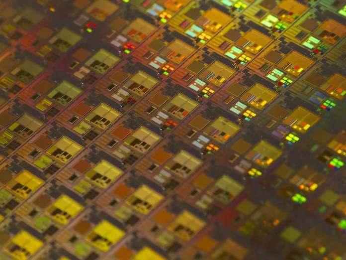 The lazy take on Taiwan Semiconductor Manufacturing Company (TSMC) is that it is just another expensive artificial-intelligence (AI) trade. It is not. TSMC is the one AI monopoly that trades at a discount to the companies it supplies — and that gap is the whole story behind a 2026 price forecast that runs from a $590 bull case down to a roughly $330 bear case. Having tracked the foundry cycle through three capital-expenditure booms, I would argue the spread between those two numbers is not really a bet on chips at all; it is a bet on the Taiwan Strait. TSMC (NYSE: TSM) closed at $430.30 on June 26, 2026 (<a href="https://stockanalysis.com/stocks/tsm/">Stock Analysis</a>), trading at about 24 times forward earnings while supplying every leading AI accelerator on the market. That is the contradiction this piece unpacks.
Here is the angle you will not find in most TSMC coverage: the bull-bear range is almost entirely a geopolitical term, not a fundamentals term. Strip out Taiwan risk and the stock screens cheap for a company compounding revenue above 30% with 60%-plus gross margins. Price the risk back in, and even monopoly economics cannot defend the multiple. The $260 gap between the bull and bear cases is the market quietly pricing the probability of a cross-strait shock — and that, not the AI cycle, is what TSM shareholders are actually trading.
<strong>Key Facts:</strong>
<blockquote>
• TSM closed at $430.30 on June 26, 2026, at roughly 24x forward earnings — <a href="https://stockanalysis.com/stocks/tsm/">Stock Analysis</a>
• TSMC raised 2026 revenue-growth guidance to above 30% in US-dollar terms on "extremely robust" AI demand — <a href="https://www.scmp.com/tech/big-tech/article/3350346/tsmc-targets-over-30-revenue-surge-2026-ramps-capex-amid-booming-ai-demand">South China Morning Post</a>
• High-performance computing (AI accelerators) was 61% of Q1 2026 revenue — <a href="https://www.investing.com/news/transcripts/earnings-call-transcript-tsmcs-q1-2026-shows-strong-growth-and-margin-gains-93CH-4617167">TSMC Q1 2026 earnings call</a>
• 2026 capital expenditure guided to a record $52bn–$56bn — <a href="https://www.trendforce.com/news/2026/01/15/news-tsmc-q1-revenue-guidance-hits-35-8b-up-38-yoy-unveils-record-56b-capex-for-2026/">TrendForce</a>
• Bank of America lifted its target to $590 (Buy); Susquehanna raised its to $575 on June 22, 2026 — <a href="https://www.gurufocus.com/news/8925501/tsm-upgraded-by-susquehanna-price-target-raised-to-575">GuruFocus</a>
• Q1 2026 net profit rose 58% year on year as demand outpaced supply — <a href="https://www.scmp.com/tech/big-tech/article/3350346/tsmc-targets-over-30-revenue-surge-2026-ramps-capex-amid-booming-ai-demand">South China Morning Post</a>
</blockquote>
What is actually happening — and why TSMC is the AI cycle's choke point
Every AI accelerator that matters — Nvidia's, AMD's, the in-house silicon from Google, Amazon and the rest — is fabricated by one company on leading-edge nodes. That is not marketing; it is the physical structure of the industry. When TSMC raised its full-year 2026 revenue-growth guidance to above 30% in dollar terms, it did so because the order book for 3-nanometre and soon 2-nanometre (N2) capacity is effectively sold out. High-performance computing, the segment that houses AI accelerators, made up 61% of first-quarter 2026 revenue, a share that keeps climbing as data-centre buildouts absorb every wafer the company can ship.
The margin picture is what separates TSMC from the rest of the supply chain. Gross margin has run in the low-to-mid 60s — above 66% in the strongest recent quarter — because leading-edge pricing power sits entirely with the foundry when there is no alternative supplier. The N2 ramp, entering risk production in the second half of 2026 and high-volume manufacturing in 2027, should defend or extend those margins as top customers migrate designs. For context on how the same AI-compute demand is repricing the memory side of the chip stack, FinanceFeeds' <a href="https://financefeeds.com/micron-stock-price-prediction-385-2000-mu-scenarios/">Micron stock price prediction</a> walks a comparable scenario range for DRAM and high-bandwidth memory.
The demand signal is not a one-quarter spike. At TSMC's June 4, 2026 annual shareholders meeting in Hsinchu, the company warned that the AI chip shortage will persist for years even as it expands capacity (<a href="https://finance.yahoo.com/sectors/technology/articles/tsmc-warns-ai-chip-shortage-131112167.html">Yahoo Finance</a>).
<blockquote>
"AI-related demand continues to be extremely robust."
— <strong>C.C. Wei</strong>, Chief Executive Officer at TSMC (<a href="https://www.investing.com/news/transcripts/earnings-call-transcript-tsmcs-q1-2026-shows-strong-growth-and-margin-gains-93CH-4617167">TSMC Q1 2026 earnings call</a>)
</blockquote>
The bull case: how TSM gets to $590
The bull thesis is straightforward and well-sponsored on Wall Street. Bank of America raised its price target to $590 with a Buy rating, and Susquehanna's Mehdi Hosseini lifted his to $575 from $500 on June 22, 2026, citing AI pricing power and the N2 transition (<a href="https://www.fxleaders.com/news/2026/06/25/taiwan-semiconductor-stock-tsm-gains-5-as-ai-pricing-power-and-bofas-590-target-lift-sentiment/">FX Leaders</a>). The mechanism is earnings, not multiple expansion: if TSMC compounds revenue above 30% in 2026 and holds gross margins in the low 60s, earnings per share grow into a $500-plus price without the stock ever getting more expensive on a forward basis.
Crucially, management is signalling that the capex surge will not crush returns. The 2026 capital-expenditure budget is a record $52bn–$56bn, but the chief financial officer has been explicit that spend is tracking demand rather than running ahead of it.
<blockquote>
"In the past few years the revenue growth outpaced the capex growth, and we do not expect in the next several years a sudden surge in capital intensity."
— <strong>Wendell Huang</strong>, Chief Financial Officer at TSMC (<a href="https://focustaiwan.tw/business/202601150020">Focus Taiwan</a>)
</blockquote>
That is the quiet heart of the bull case. A monopoly that can raise prices, expand margin through a node transition, and grow capex slower than revenue is a compounding machine. At a steady 24-times forward multiple, rising earnings alone carry TSM toward the $470–$500 base-case zone, and a modest re-rating on a clean geopolitical tape gets it to the $590 bull target. The buy-side appetite is already visible in how brokers are widening retail access to AI names, a trend FinanceFeeds covered when <a href="https://financefeeds.com/fortrade-adds-ai-space-and-networking-stocks-as-retail-demand-moves-beyond-mega-caps/">Fortrade added AI, space and networking stocks</a> as demand moved beyond the mega-caps.
Market impact and the data: a discount hiding in plain sight
Here is the data synthesis that frames the whole call. TSM trades at roughly 24 times forward earnings — about 11% above its own five-year average, and around 24% above one independent fair-value estimate — yet it sits below the forward multiples of the fabless customers that depend on it entirely. The market is paying up for Nvidia's design margins while discounting the single supplier without which those designs are inert silicon. That inversion is the "geopolitical discount" in numbers.
Scenario2026 targetImplied forward P/EPrimary driver
<strong>Bull</strong>$590~31xAI pricing power, N2 ramp, clean geopolitics — BofA target
<strong>Base</strong>$470–$500~24xEarnings growth at a flat multiple
<strong>Bear</strong>$330~18xCross-strait shock or AI-capex digestion, multiple derate
<em>Sources: spot price and forward multiple (<a href="https://stockanalysis.com/stocks/tsm/">Stock Analysis</a>, June 26, 2026); analyst targets (<a href="https://www.gurufocus.com/news/8925501/tsm-upgraded-by-susquehanna-price-target-raised-to-575">GuruFocus</a>). Scenario multiples are illustrative, applied to consensus 2026 earnings.</em>
The growth runway behind the multiple is what makes the discount stand out. TSMC has guided that AI-related revenue will compound at a high-50s percentage rate from its 2024 baseline through 2029, and first-quarter 2026 revenue landed near $35.9bn, up roughly 40% year on year (<a href="https://www.investing.com/news/transcripts/earnings-call-transcript-tsmcs-q1-2026-shows-strong-growth-and-margin-gains-93CH-4617167">TSMC Q1 2026 earnings call</a>). Combine that multi-year accelerator-demand curve with gross margins above 60% and a flat 24-times forward multiple, and the base case almost writes itself: earnings grow into a higher share price. The only way that arithmetic breaks on fundamentals is a demand air-pocket, which is why the bear case leans on the capex cycle and geopolitics rather than on the income statement.
The bear arithmetic is the mirror image of the bull. A record $52bn–$56bn capex bill means free cash flow is hostage to demand staying "insane," in the language used around the June shareholders meeting. If the AI-accelerator order book digests even briefly — a pause in hyperscaler spend, an inventory correction — a stock at 24-times forward earnings derates fast, and the historical trough multiple nearer 18 times implies a price around $330. No company-specific moat protects a cyclical at the wrong point in the capex cycle, and the comparison with how quickly tech leadership can wobble is fresh: see FinanceFeeds on how <a href="https://financefeeds.com/china-bypasses-chip-export-curbs/">China is bypassing chip-export curbs with retrofitted equipment</a>, a reminder that the competitive and political backdrop is not static.
The real tension: geopolitics, export controls, and the Taiwan discount
For most stocks the regulatory overlay is a footnote. For TSMC it is the entire bear case. The company manufactures the overwhelming majority of the world's leading-edge logic about 100 miles from mainland China, and Beijing has continued to reiterate its reunification goal, including references to the possible use of force. That single fact is why the stock carries a structural discount to its AI-cycle role, and why analysts who model TSMC on fundamentals alone keep arriving at "undervalued" while the market refuses to close the gap.
Export controls cut both ways. US restrictions on advanced-node sales to China have, so far, protected TSMC's Western customer base and pricing power, but they also make the company a central node in an escalating technology cold war. Washington's push to onshore capacity — TSMC's Arizona fabs among them — diversifies the geographic risk over time but cannot relocate the leading edge overnight; the most advanced nodes still ramp first in Taiwan. The investment question is therefore unusually binary: in the base and bull cases, the geopolitical discount slowly narrows as Arizona scales and tensions stay cold; in the bear case, a single headline reprices the equity below $350 regardless of how strong the order book looks. Most analysts assign a low probability to outright conflict, which is precisely why the discount persists rather than collapses — the market is holding a small, fat-tailed risk it cannot diversify away.
There is a second-order regulatory wrinkle that the bull case tends to gloss over. The same export-control regime that shields TSMC's Western margins also caps the addressable market, walling off China — historically a meaningful slice of global semiconductor demand — from the company's leading-edge nodes. As Washington tightens and Beijing accelerates its domestic-foundry push, TSMC's long-run growth depends on Western AI demand staying strong enough to more than replace the China revenue it is being told to forgo. So far it has, comfortably, because hyperscaler spend dwarfs the lost business. But it makes the company structurally more levered to a single end-market — AI data centres — than its diversified history would suggest, and that concentration is itself a risk the geopolitical-discount framing tends to understate.
What happens next: predictions for the rest of 2026
Three things to watch decide which scenario wins. First, the N2 ramp: clean risk-production milestones in the second half of 2026 keep the margin story intact and support the base-to-bull path toward $470–$590. Second, hyperscaler capex commentary through the next two earnings seasons; any sign that AI-accelerator orders are being pulled forward rather than sustained is the first crack in the bull case. Third, the cross-strait tape — the one variable no model can forecast and the only one that triggers the $330 bear case.
My base case is that TSM grinds higher into year-end 2026 toward the high-$400s as earnings compound and the multiple holds, with the BofA-style $590 bull target reachable only if the geopolitical discount visibly narrows. The asymmetry is unusual: the upside is a steady compounding story, while the downside is a step-function event with low probability but severe magnitude. For a foundry monopoly at the centre of the AI build-out, that is the trade — you are long the most defensible business in technology and short a geopolitical option you cannot hedge. For investors who can stomach that asymmetry, the multi-year AI build-out and the N2 monopoly are the reasons the bull case keeps getting louder; for those who cannot, the bear case is one headline away. Either way, TSMC's 2026 price action will be decided less by chips than by diplomacy — a rare case where the macro tape, not the order book, sets the range.
Frequently asked questions
<strong>What is the TSMC stock forecast for 2026?</strong>
The scenario range runs from a $590 bull case, anchored to Bank of America's target, to a roughly $330 bear case driven by a multiple derate. The base case sits around $470–$500, with the stock at $430.30 as of June 26, 2026, and the outcome hinges mainly on cross-strait geopolitics rather than AI demand.
<strong>Why is TSMC considered undervalued?</strong>
TSM trades near 24 times forward earnings, below the forward multiples of the fabless customers it supplies, despite a near-monopoly on leading-edge logic and gross margins above 60%. The gap reflects a structural "geopolitical discount" tied to Taiwan, not weak fundamentals.
<strong>What is the biggest risk to TSMC stock?</strong>
A cross-strait conflict or serious escalation between China and Taiwan is the dominant risk. Because TSMC concentrates leading-edge production on the island, a geopolitical shock could reprice the equity sharply regardless of its order book, which is why the bear case sits near $330.
<strong>How fast is TSMC growing?</strong>
TSMC raised its 2026 revenue-growth guidance to above 30% in US-dollar terms, with first-quarter 2026 net profit up 58% year on year. High-performance computing, which includes AI accelerators, made up 61% of first-quarter revenue.
<strong>What could push TSM to the $590 bull case?</strong>
Sustained AI-accelerator demand, a clean N2 ramp through 2026–2027, continued gross-margin strength above 60%, and a narrowing geopolitical discount would let earnings growth carry the stock toward the Bank of America and Susquehanna targets of $575–$590.
<strong>How does TSMC's valuation compare with its peers?</strong>
At roughly 24 times forward earnings, TSM trades below the forward multiples of leading fabless chip designers such as Nvidia, even though it manufactures their most advanced products. Memory peers tell a different scenario story; FinanceFeeds' Micron analysis maps a far wider outcome range tied to the high-bandwidth-memory cycle.
<em>This article is informational analysis only and is not financial, investment, or trading advice. Equity markets are volatile and prices can move sharply against any forecast. Price targets cited are analyst and scenario estimates, not guarantees. Past performance and analyst projections do not assure future results. Do your own research and consult a regulated financial adviser before making any investment decision.</em>