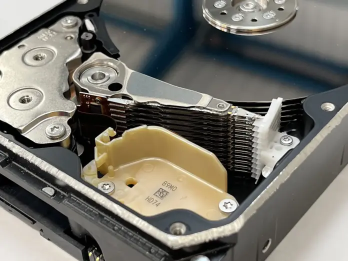 The popular WDC stock prediction this month starts from the wrong premise: that Western Digital "crashed on record earnings" because the AI storage trade is finished. The tape says otherwise. On 6 August, the day after WD beat its own guidance, the stock fell 13.0% to $451.52 while Seagate, which supplies nearline hard drives to the same hyperscalers, rose 1.8%. That was not a verdict on storage demand. It was a verdict on Western Digital relative to its main competitor, and it explains why WDC closed at $460.93 on 10 September, 38% below its highest close of $746.23 on 18 June, while Seagate sits just 21% below its own peak (<a href="https://stockanalysis.com/stocks/wdc/history/">stockanalysis.com daily closes</a>, 10 September 2026).
Here is what most coverage misses. Strip out the noise and the "discount" has almost closed. Both companies guided September-quarter revenue to exactly $4.1bn. Annualise the guided non-GAAP EPS and WDC trades at 28.8 times ($4.00 x 4) against Seagate's 29.5 times ($7.30 x 4). The drawdown removed a premium, it did not create a bargain. Two more traps sit in the numbers: trailing GAAP EPS of $24.28 includes a $6.5bn gain on the retained SanDisk stake, so screens showing a 19x trailing multiple are flattering the stock (the non-GAAP figure is $10.22, or 45x), and the $2.59bn WD spent on repurchases in fiscal 2026 did not shrink the diluted share count, which held at roughly 385-388 million as convertible notes were settled in stock.
Key facts
Fiscal Q4 2026 revenue $3.75bn, up 44% year on year; non-GAAP gross margin 54.4%; non-GAAP EPS $3.56 — <a href="https://www.sec.gov/Archives/edgar/data/106040/000162828026053305/a4ex991-pressreleaseq426.htm">WD 8-K Exhibit 99.1, 5 August 2026</a>
September-quarter guidance: revenue $4.1bn ±$100m (up 42% to 49%), gross margin 55%-56%, EPS $4.00 ±$0.15 on about 388m diluted shares — <a href="https://www.sec.gov/Archives/edgar/data/106040/000162828026053305/a4ex991-pressreleaseq426.htm">WD 8-K Exhibit 99.1, 5 August 2026</a>
WDC closed at $460.93 on 10 September, down 38.2% from the $746.23 highest close on 18 June; the 52-week range is $93.92 to $799.87 — <a href="https://stockanalysis.com/stocks/wdc/">stockanalysis.com, 10 September 2026</a>
Fiscal 2026 free cash flow $3.51bn; $2.59bn of share repurchases and $184m of dividends — <a href="https://www.sec.gov/Archives/edgar/data/106040/000162828026057139/wdc-20260703.htm">WD Form 10-K, 14 August 2026</a>
Top 10 customers were 73% of fiscal 2026 revenue; three customers alone were 16%, 15% and 13% — <a href="https://www.sec.gov/Archives/edgar/data/106040/000162828026057139/wdc-20260703.htm">WD Form 10-K, 14 August 2026</a>
Seagate guided the same $4.1bn September-quarter revenue with non-GAAP EPS of $7.30 ±$0.20 — <a href="https://www.sec.gov/Archives/edgar/data/1137789/000113778926000153/stxq42026pressreleasefinan.htm">Seagate 8-K Exhibit 99.1, 28 July 2026</a>
On 26 August WD exchanged $191.0m of its 3.00% 2028 convertible notes for $192.7m cash plus 4,653,572 new shares — <a href="https://www.sec.gov/Archives/edgar/data/106040/000119312526371309/d482249d8ka.htm">WD 8-K/A, 27 August 2026</a>
Why WDC stock is 38% below its June high
The slide came in two distinct legs, and they have different causes. The first, from the 18 June peak to mid-July, hit the whole memory and storage complex at once. On 26 June WDC fell 13.2% and Seagate 12.2%; on 16 July WDC dropped 9.2%, Seagate 10.0% and SanDisk 12.6%. When four names with different products and pricing cycles fall together, the driver is positioning, not fundamentals. After a year in which WDC rose from $95.02 to a June peak nearly eight times higher, the crowded trade simply unwound.
The second leg is the one that matters for the forecast, because it was specific to Western Digital. WD reported fiscal fourth-quarter results after the bell on 5 August. Revenue of $3.75bn and non-GAAP EPS of $3.56 beat the consensus of roughly $3.69bn and $3.33 cited by <a href="https://ca.finance.yahoo.com/news/western-digital-shares-fall-margin-145700744.html">Proactive via Yahoo Finance</a> on 6 August. Guidance pointed to September-quarter revenue growth of 42% to 49%. The stock still fell 13.0% the next day while Seagate gained. The reason was the gross-margin guide of 55%-56%, which the market compared directly with Seagate's.
That comparison is harsh because Seagate is further along the HAMR (heat-assisted magnetic recording) curve, the technology that pushes a single drive past 40 terabytes and cuts cost per terabyte. Seagate has already built its Mozaic product line around HAMR. WD's own 44-terabyte HAMR drive is scheduled for the first half of calendar 2027. In the meantime WD is leaning on a 40-terabyte ePMR drive, which began shipping in the June quarter, and on UltraSMR, which it expects to make up about 60% of nearline exabytes as it exits fiscal 2027.
Since then the stock has traded in a range of roughly $434 to $536 on a closing basis, with the latest move a 4.4% drop on 10 September. Pre-market on 11 September it was indicated at $463.00 at 4:11 a.m. New York time (stockanalysis.com). This forecast anchors on the $460.93 regular-session close, not the pre-market indication.
The social conversation has not caught up with the distinction. A scan of the past 30 days of social posts found mostly YouTube explainers titled in the "crashed on record earnings" mould and thin Reddit threads, consistent with a retail audience treating the drop as a demand scare. Coverage was partial (no X, TikTok or Instagram results), so treat that read as directional.
What Western Digital and Seagate are saying
Management's message on the call was that demand is not the problem and pricing is getting better, not worse. "As global data creation continues to accelerate, we enter fiscal year 2027 with continued confidence in the durability of demand and with increasing visibility into our business," said <a href="https://www.sec.gov/Archives/edgar/data/106040/000162828026053305/a4ex991-pressreleaseq426.htm">Irving Tan, Chief Executive Officer at Western Digital</a>, in the 5 August results release.
The pricing detail came from the finance chief. According to <a href="https://stockanalysis.com/stocks/wdc/transcripts/658556-q4-2026/">Kris Sennesael, Chief Financial Officer at Western Digital</a>, speaking on the fiscal Q4 call, "the blended average year-over-year price increase per terabyte improved from high single digits last quarter to high teens this quarter." That is the single most important number for the bull case. WD shipped 231 exabytes in the quarter, up 22%, so revenue grew faster than volume because each terabyte sold for more.
The first question on that call went straight to the margin gap. "It's hard not to compare your results with your main competitor, where they're seeing better sequential top-line growth and targeting gross margins nearly 200 basis points higher than your September guide," said <a href="https://stockanalysis.com/stocks/wdc/transcripts/658556-q4-2026/">CJ Muse, analyst at Cantor Fitzgerald</a>. Tan's reply was that "there are always quarter-to-quarter variations in terms of gross margin," pointing to the timing of long-term agreement (LTA) renewals and the ramp of new drive platforms.
On visibility, Tan was more concrete: "We are very much in the throes of discussions with customers to establish LTAs for calendar year 2029, 2030, and 2031 as well." Long-dated contracts cut both ways. They lock in volume, but they also lock in price, which caps the upside if spot pricing keeps climbing.
Seagate's framing a week earlier was aimed at exactly the technology gap investors are pricing. "Seagate is well positioned to address strengthening exabyte demand through our Mozaic platform and differentiated HAMR technology roadmap," said <a href="https://www.sec.gov/Archives/edgar/data/1137789/000113778926000153/stxq42026pressreleasefinan.htm">Dave Mosley, Chair and Chief Executive Officer at Seagate</a>, on 28 July.
The demand side still looks intact. Alphabet lifted its 2026 capital expenditure forecast to $195bn-$205bn from $180bn-$190bn on 22 July, and "We're still in a supply-constrained environment," <a href="https://www.cnbc.com/2026/07/22/google-earnings-q2-goog-live-updates.html">Anat Ashkenazi, Chief Financial Officer at Alphabet</a>, told analysts. Supply was already tight a year ago: TrendForce reported in September 2025 that <a href="https://www.trendforce.com/presscenter/news/20250915-12714.html">nearline HDD lead times had stretched from a few weeks to over 52 weeks</a>.
WDC vs Seagate: the numbers behind the discount
The chart shows both legs of the drawdown and where the three scenario levels sit against the June peak.
WDC daily closes, 10 September 2025 to 10 September 2026, with FinanceFeeds bull ($725), base ($550) and bear ($290) levels. Source: stockanalysis.com; WD SEC filings.
Set side by side, the two companies look far more alike than the 17-percentage-point gap in their drawdowns suggests. WD actually printed the higher gross margin last quarter. What Seagate has is a higher earnings run-rate per share and an earlier HAMR ramp.
MetricWestern Digital (WDC)Seagate (STX)
Close, 10 Sep 2026$460.93$862.33
Highest close (date)$746.23 (18 Jun)$1,094.04 (22 Jun)
Drawdown from highest close-38.2%-21.2%
Move on 6 Aug 2026-13.0%+1.8%
June-quarter revenue$3.75bn$3.63bn
June-quarter non-GAAP gross margin54.4%52.7%
September-quarter revenue guide$4.1bn ±$100m$4.1bn ±$100m
September-quarter EPS guide$4.00 ±$0.15$7.30 ±$0.20
Price / annualised guided EPS28.8x29.5x
Fiscal 2026 free cash flow$3.51bn$3.1bn
HAMR status44TB drive due 1H calendar 2027Mozaic HAMR shipping
Sources: company 8-K earnings releases (WD 5 August 2026, Seagate 28 July 2026) and stockanalysis.com closing prices. Multiples are FinanceFeeds calculations.
Two other numbers shape the valuation. At 360.5 million shares outstanding on 7 August (per the 10-K cover), WD's market value at $460.93 is about $166bn. On fiscal 2026 free cash flow of $3.51bn that is a 2.1% yield; on the June quarter's $1.28bn annualised, about 3.1%. That is not cheap for a hardware supplier, which is why the bear case below does not need a demand collapse to work. For the memory side of the same trade, see our <a href="https://financefeeds.com/micron-mu-stock-prediction-1500-bull-560-bear/">Micron (MU) bull and bear levels</a> and the <a href="https://financefeeds.com/sandisk-sndk-stock-prediction-2650-bull-780-bear/">SanDisk (SNDK) forecast</a>, the flash business WD spun off in February 2025.
The structural tension: concentration, converts and the SSD threat
Three structural issues sit under the headline numbers, and each one feeds a different scenario.
<strong>Customer concentration.</strong> Cloud was 89% of fiscal 2026 revenue, the top 10 customers 73% and three customers 44% between them, according to the 10-K. That is up from 55% for the top 10 in fiscal 2024. Pricing power with a customer who takes 16% of your output is real only as long as supply stays tight. If one hyperscaler pauses to digest the drives it has bought, WD has little diversified demand to fall back on.
<strong>The share count.</strong> Having tracked WD's capital structure since the SanDisk separation, the pattern worth flagging is that repurchases are mostly offsetting convertible dilution rather than shrinking the company. Basic shares rose from 339.0 million in January to 360.5 million in August, mainly because a June exchange of $858m of 2028 convertible notes was settled with $860m of cash and 21.3 million shares. The 26 August exchange added another 4.65 million shares. Diluted shares were about 388 million in the June quarter and are guided at about 388 million again. The good news is the balance sheet: WD has now used its entire SanDisk stake (28.8 million shares at the spin) to retire debt and repurchase stock, and ended fiscal 2026 with $1.58bn of cash, no long-term debt and $1.05bn of borrowings classified as current, including $350m drawn on a revolver that matures in January 2027.
<strong>Substitution.</strong> TrendForce's September 2025 note warned that the HDD shortage was pushing cloud providers to test high-capacity QLC SSDs for cold data, which offer about 30% lower power consumption. For now cost per terabyte keeps hard drives in the cold tier, but every quarter of 52-week lead times gives cloud customers a reason to redesign around flash. Our coverage of the <a href="https://financefeeds.com/kioxia-nand-price-ceiling-70-percent-sk-hynix/">NAND price ceiling at Kioxia and SK Hynix</a> tracks the other side of that substitution trade, and our list of <a href="https://financefeeds.com/stocks-that-could-be-the-next-sandisk/">stocks that could be the next SanDisk</a> covers the names benefiting from it.
Capital spending is also turning up. WD said fiscal 2027 capex will be higher than fiscal 2026's $418m as it invests in heads, media and automation, though Sennesael said in his prepared remarks that more exabytes from new platforms "does not require spending CapEx to add unit capacity." Supply discipline is the whole bull case, so any sign that either HDD maker is adding unit capacity would be the clearest warning.
WDC stock prediction: bull, base and bear cases
All three scenarios use the same method: an estimate of fiscal 2028 (year ending mid-2028) non-GAAP EPS multiplied by the multiple the market is likely to pay for it 12 months from now. The starting point is WD's own guide of $4.00 for the September quarter. The FinanceFeeds base path puts fiscal 2027 EPS at about $18 ($4.00, then roughly $4.40, $4.70 and $5.00), assuming pricing and the 40-terabyte ramp keep margins rising in line with guidance.
Base case: $550 (+19%), probability 45%
Fiscal 2028 EPS of about $22 at 25 times. That assumes revenue grows around 20% in fiscal 2028 as exabyte growth runs at the 25%-plus rate Tan described, price per terabyte rises more slowly than the current high-teens pace as LTAs reset, and operating margin drifts into the high 40s. The multiple compresses modestly from today's 28.8x run-rate as growth normalises. The result sits back inside the range WDC traded through in late July and early August.
Bull case: $725 (+57%), probability 25%
Fiscal 2028 EPS of about $26 at 28 times. This needs three things at once: price-per-terabyte gains staying in the high teens or better through calendar 2027, the 44-terabyte HAMR drive shipping on schedule in the first half of calendar 2027, and gross margin moving toward 60% so WD closes the gap with Seagate. On about 375 million diluted shares, $26 implies roughly $9.75bn of net income, which fits a revenue base near $23.5bn at a 50% operating margin. Even then, $725 remains just below the 18 June highest close.
Bear case: $290 (-37%), probability 30%
EPS stalls around $16, close to today's run-rate, and the multiple falls to 18 times. The route there is not a demand collapse. It is pricing peaking as long-dated LTAs lock in lower escalators, a hyperscaler digesting inventory, HAMR slipping into late 2027 while Seagate keeps ramping, and faster QLC substitution at the cold tier. At $290 the market value would be about $105bn, a free-cash-flow yield of roughly 5% on a $5.5bn fiscal 2027 estimate, a yield that would price in very little growth beyond fiscal 2027.
The probability-weighted value is about $516, 12% above the $460.93 close. The bull target is above spot and the bear target below it, as required. The skew is positive but narrower than the chart suggests, because the base case assumes margin gains WD has guided but not yet delivered.
<strong>Invalidation.</strong> The bull case is off the table if the December-quarter gross-margin guide, due with fiscal Q1 results, comes in below 55%, or if management moves the HAMR launch beyond the first half of calendar 2027. The bear case weakens sharply if WD guides December-quarter gross margin at 57% or higher and confirms signed LTAs running to 2031 with price escalators intact.
<strong>What would change my mind.</strong> A narrowing of the gross-margin gap with Seagate for two consecutive quarters would push me toward the bull case. Evidence that either HDD maker is adding unit capacity, or that a top-three customer is moving cold storage to QLC flash at scale, would push me toward the bear. For a sense of how the server side of the same AI build-out is being priced, compare our <a href="https://financefeeds.com/dell-stock-prediction-640-bull-case-vs-330-bear-case/">Dell bull and bear case</a>.
Frequently asked questions
What is the WDC stock prediction for the next 12 months?
FinanceFeeds sets a base case of $550, 19% above the $460.93 close on 10 September 2026, with a $725 bull case and a $290 bear case. The base case assumes fiscal 2028 non-GAAP EPS of about $22 valued at 25 times. The probabilities are 45% base, 25% bull and 30% bear, which produces a probability-weighted value of roughly $516.
Why did Western Digital stock fall after beating earnings?
WD beat revenue and EPS expectations for its fiscal fourth quarter and guided higher, but its September-quarter gross-margin guide of 55%-56% sat below what Seagate was implying. Investors read that as a sign WD is behind in HAMR drive technology. The stock fell 13.0% on 6 August while Seagate rose 1.8%.
Does Western Digital still own shares in SanDisk?
No. WD kept 28.8 million SanDisk shares at the February 2025 separation and has now used all of them. It swapped shares to cut debt in June 2025 and February 2026, then exchanged the final 1.7 million SanDisk shares for 4.8 million of its own shares in the June 2026 quarter. That stake produced a $6.5bn gain that inflates fiscal 2026 GAAP EPS.
How does WDC compare with Seagate (STX)?
Both guided $4.1bn of September-quarter revenue. WD posted the higher June-quarter non-GAAP gross margin at 54.4% against Seagate's 52.7%, but analysts on WD's call said Seagate is targeting margins nearly 200 basis points above WD's guide, and Seagate is further along its HAMR ramp. On annualised guided EPS, WDC trades at 28.8 times and STX at 29.5 times, so the valuation gap is smaller than the drawdown gap suggests.
When does HAMR matter for Western Digital?
WD says its 44-terabyte HAMR drive will ship in the first half of calendar 2027, with 50-terabyte products following in the second half. Until then it relies on 40-terabyte ePMR drives and UltraSMR. Any slip in that schedule would be the most direct threat to the margin catch-up that the base and bull cases assume.
Does Western Digital pay a dividend?
Yes. The board declared a quarterly dividend of $0.15 per share, payable on 17 September 2026 to holders of record on 8 September. At $460.93 that is a yield of about 0.13%. Most shareholder returns come through repurchases, which totalled $2.59bn in fiscal 2026.
<em>Disclaimer: This article is analysis and commentary, not investment advice. Price scenarios are estimates that may prove wrong, and past performance does not predict future results. Trading equities involves risk, and your capital is at risk. Do your own research and consider consulting a licensed financial adviser before making any investment decision.</em>
